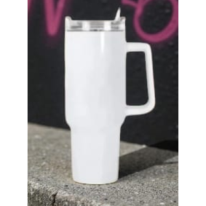 White insulated travel mug with lid and built-in handle on a concrete surface