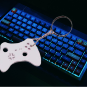 White game controller resting on a blue-lit keyboard with a magnifying glass hovering above the keys.