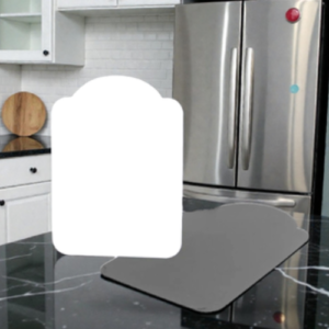 Modern kitchen with a stainless steel refrigerator, white cabinets, and a dark marble island; a white rounded overlay covers the center.